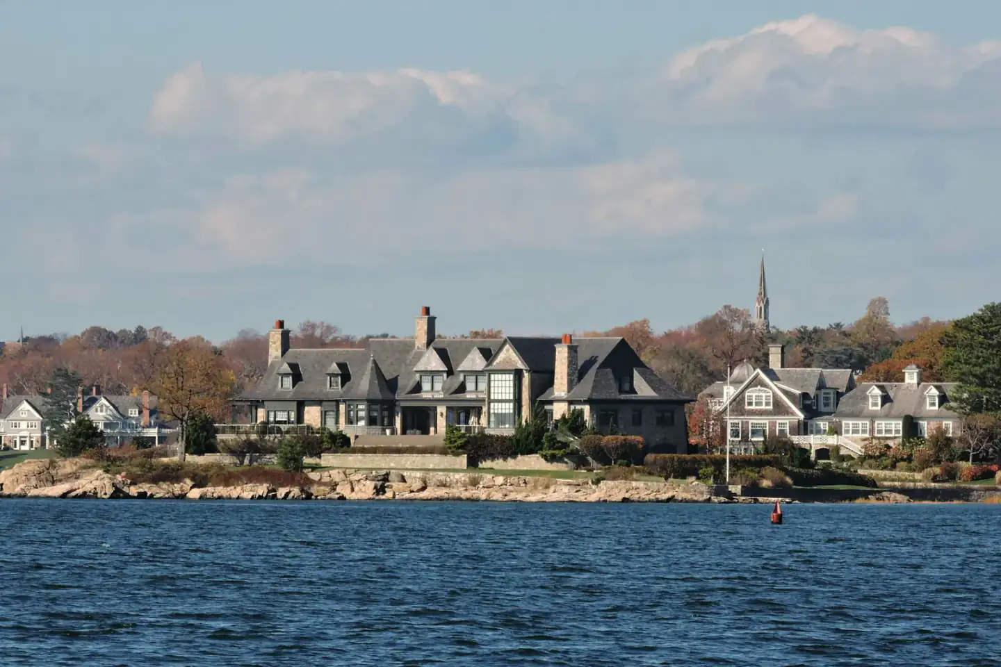 Waterfront homes along the shoreline seen from Tod's Point in Greenwich, Connecticut