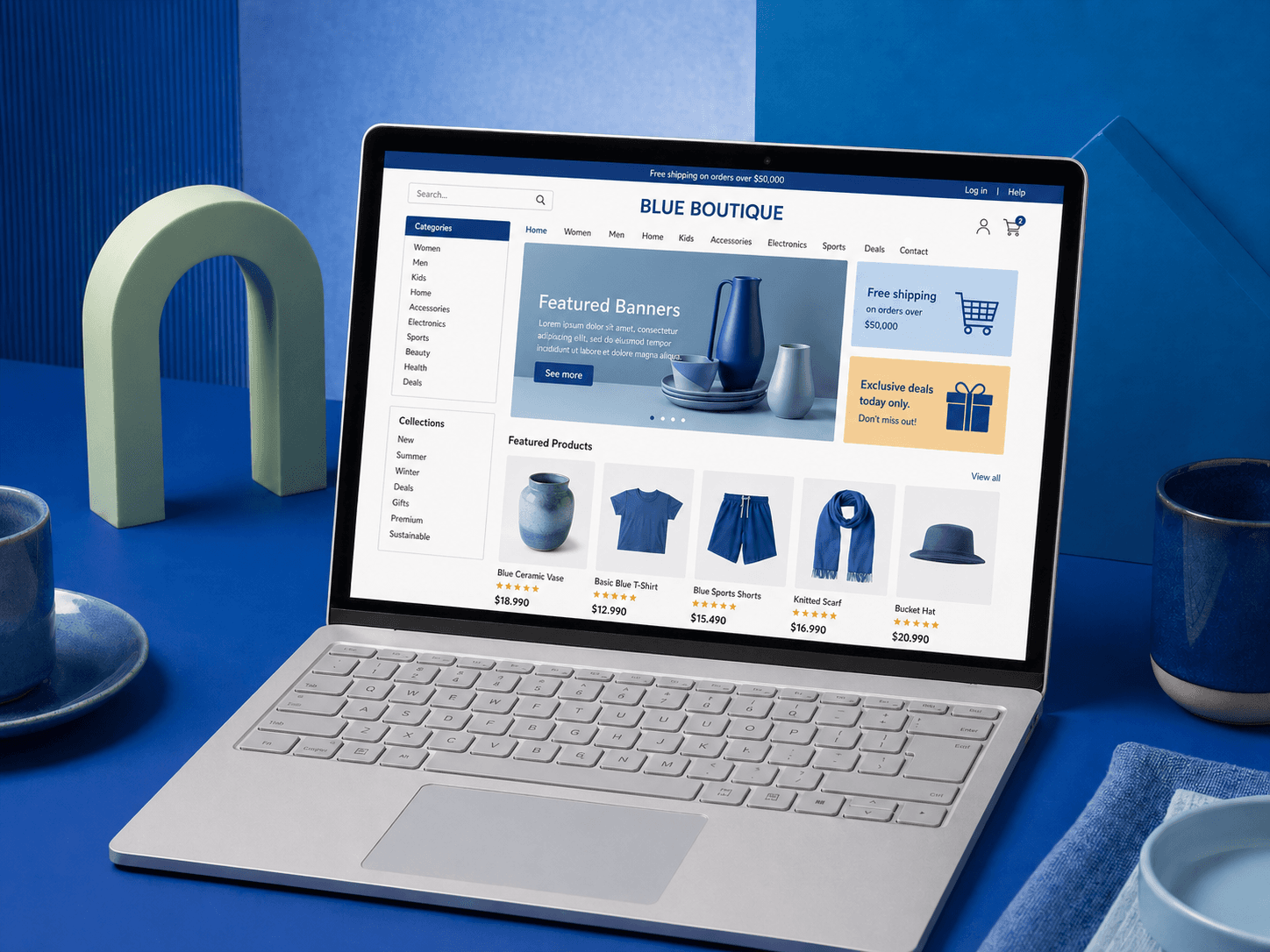 Laptop on a blue desk displaying a clothing and homeware online store with featured products